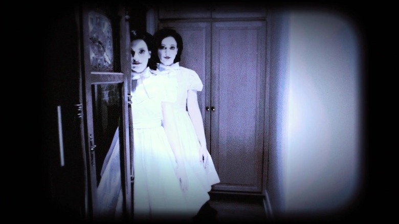 Ghost girls standing in hall