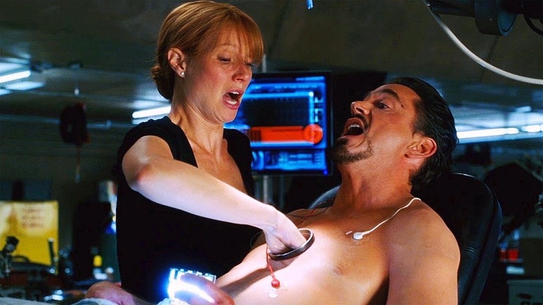 Pepper puts her hand in Tony's chest cavity