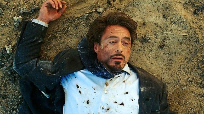 Tony caught in a blast lying in dirt