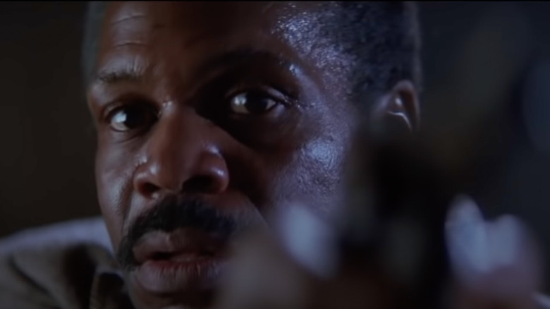 Murtaugh points a gun