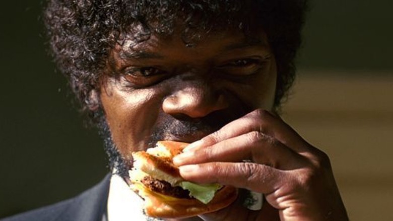 Jules eating a burger in Pulp Fiction