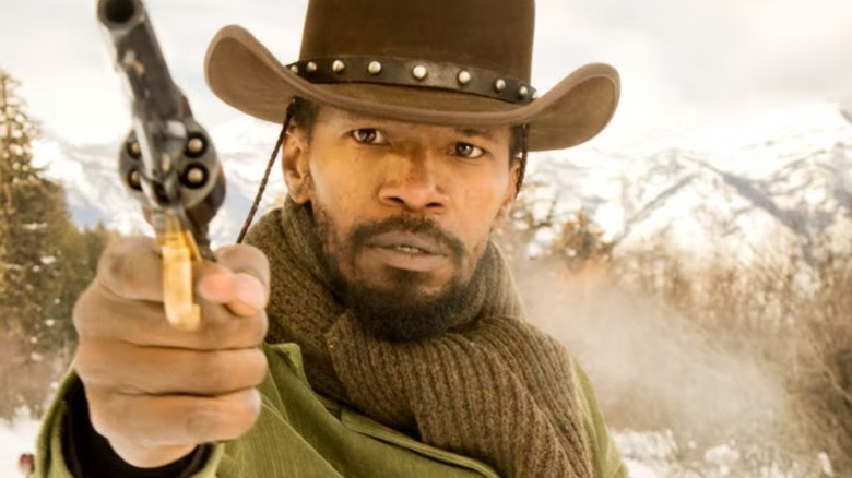 Django holding a gun