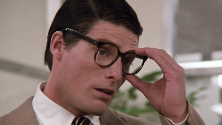 Clark Kent adjusting glasses