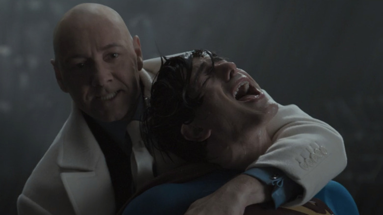 Lex Luthor wrestling anguished Superman