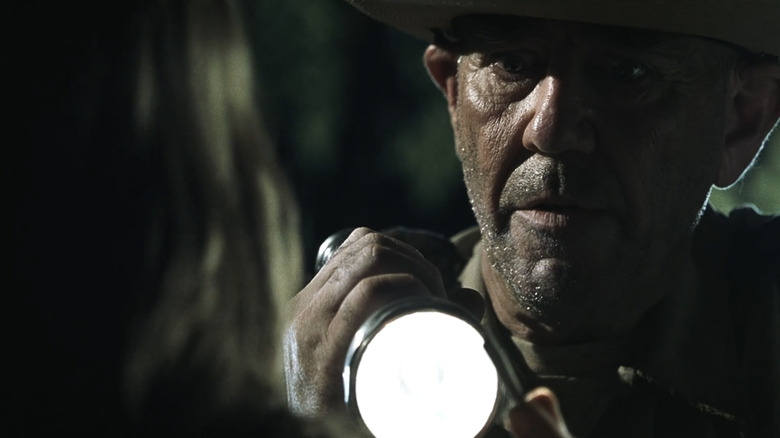 Sheriff Hoyt aims flashlight