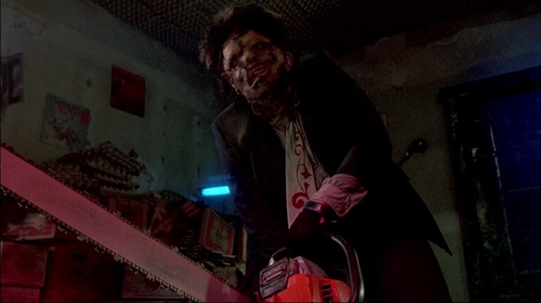 Leatherface holds chainsaw