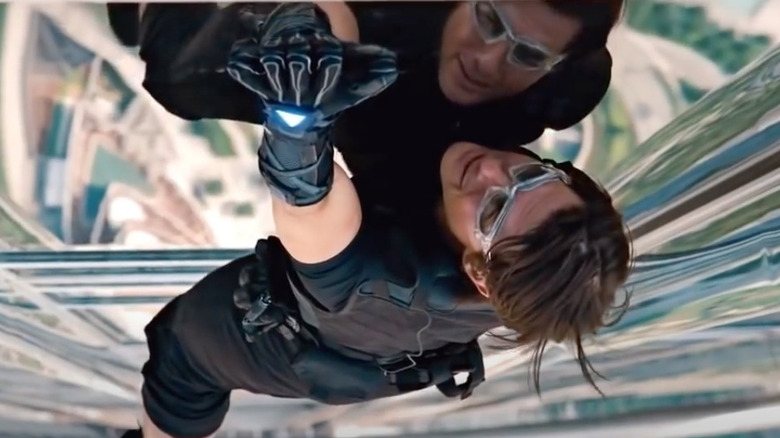 Ethan Hunt dangles from a building