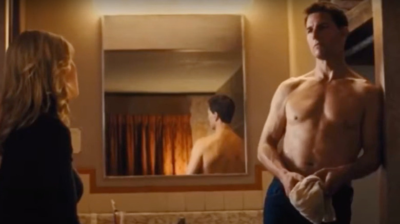 Jack Reacher stands shirtless