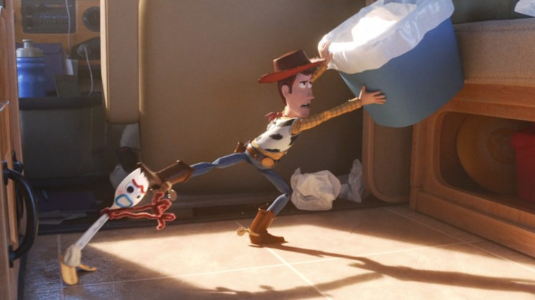 Woody keeping Forky from trash