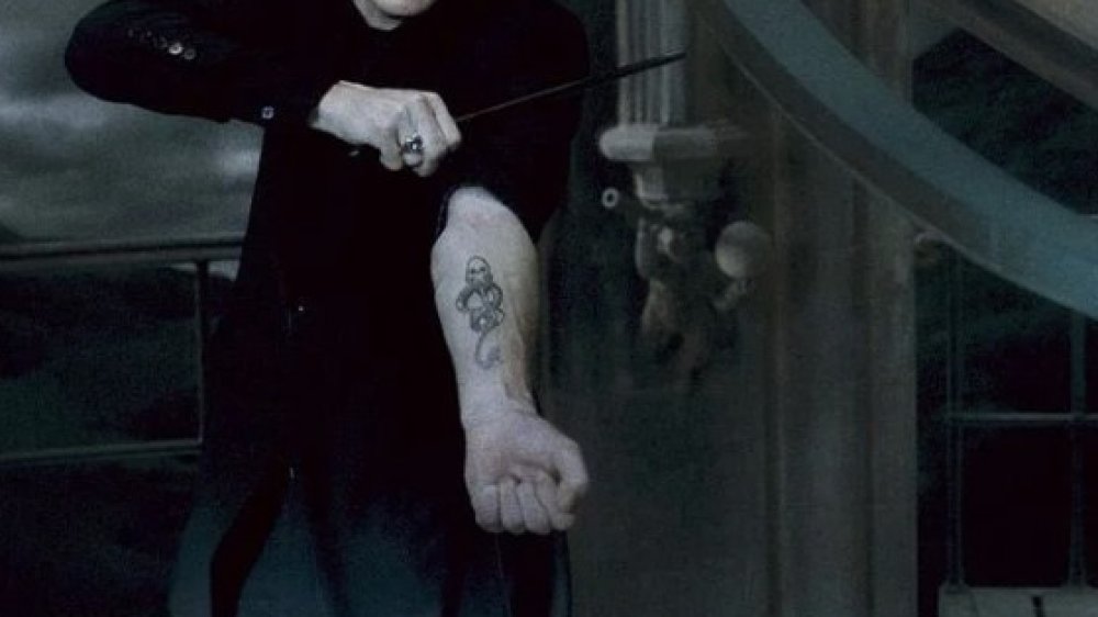 Tom Felton as Draco Malfoy, exposing his Dark Mark in Harry Potter and the Half-Blood Prince