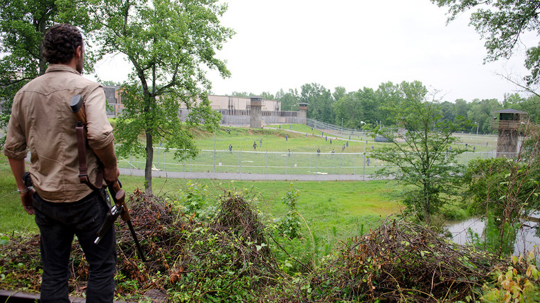 Rick looking at the prison and its freshly-mowed lawn