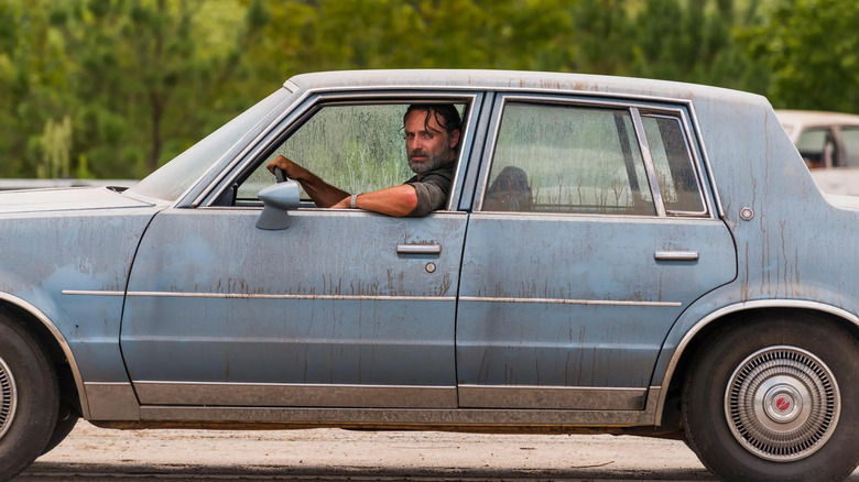 Rick driving a car