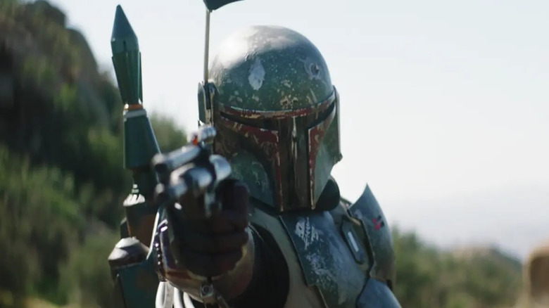 Boba Fett pointing his blaster