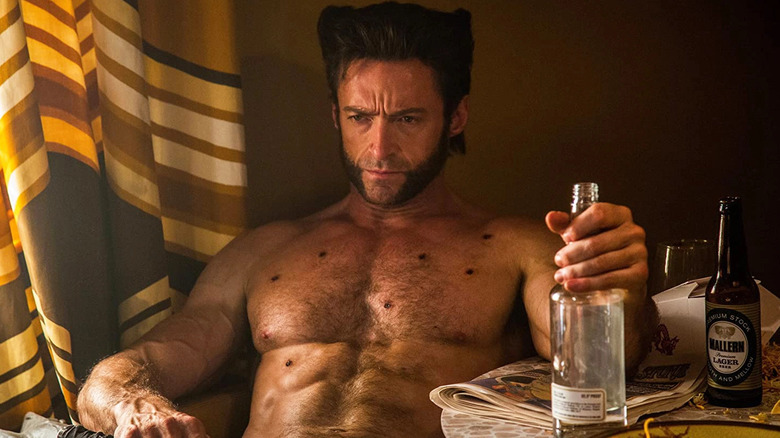 Wolverine drinks from a bottle