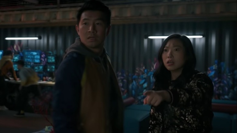 Shang-Chi Simu Liu and Awkwafina see an approaching army