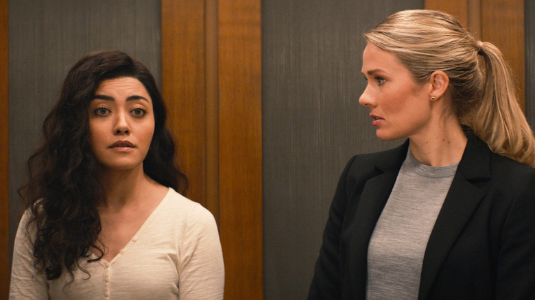 Lucy and Kate standing in elevator 