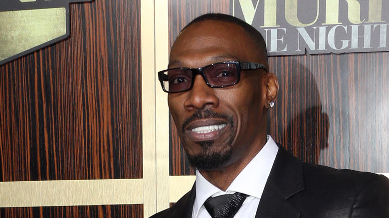 Charlie Murphy smiles