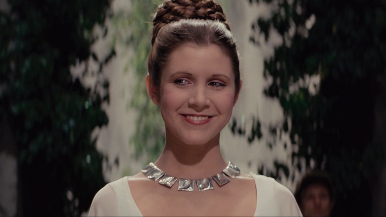 Princess Leia smiling at the end of Star Wars