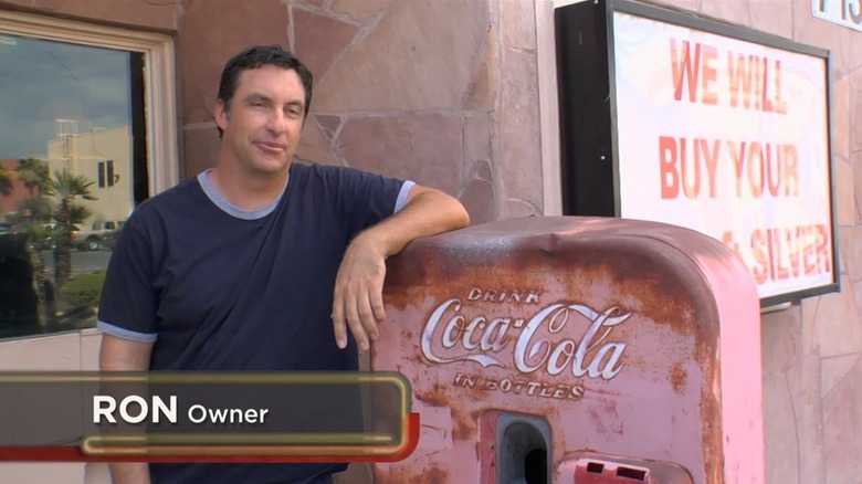 Ron Dale shows off the Coke machine