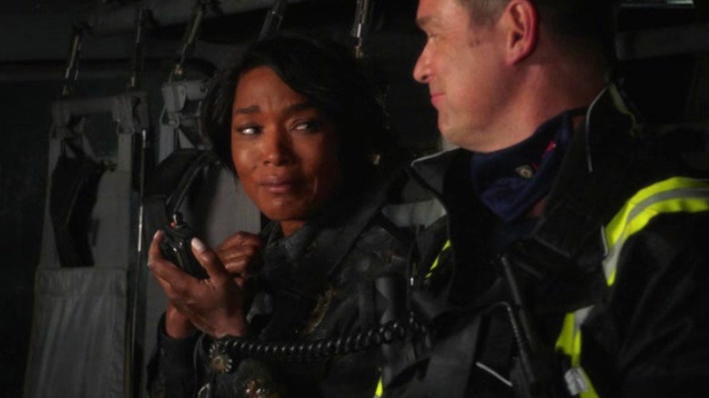 Peter Krause and Angela Bassett smile in 9-1-1