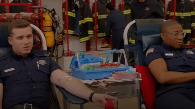 Aisha Hinds and Oliver Stark give blood in 9-1-1