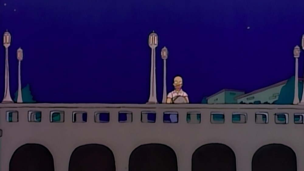 Homer stands on bridge