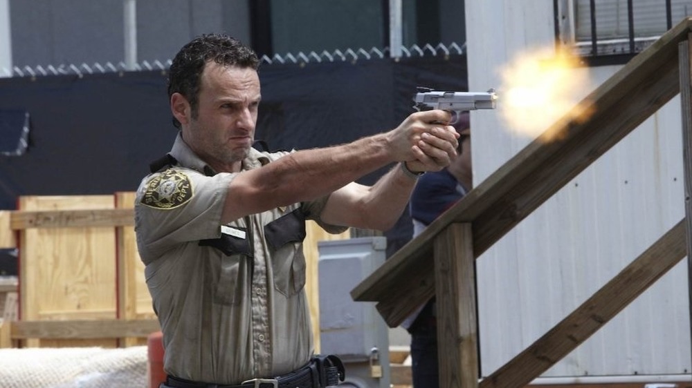 Rick firing gun