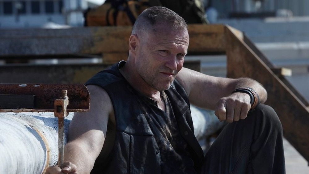 Merle chained to pipe