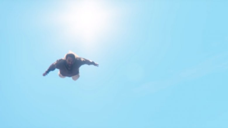 Jason Momoa as Arthur Curry/Aquaman, soaring through the air