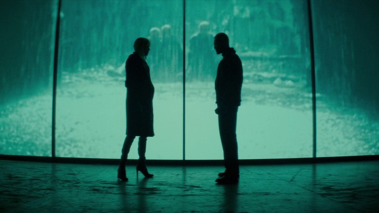 Figures silhouetted against movie screen