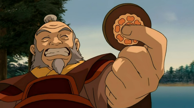 Iroh showing off his lotus tile