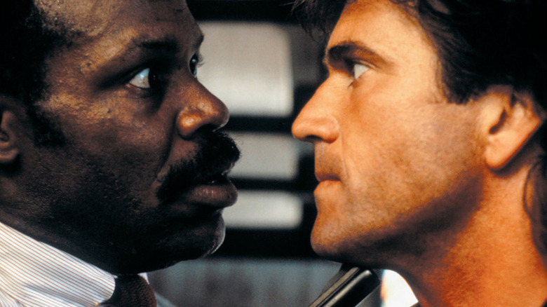 Riggs and Murtaugh glaring at each other