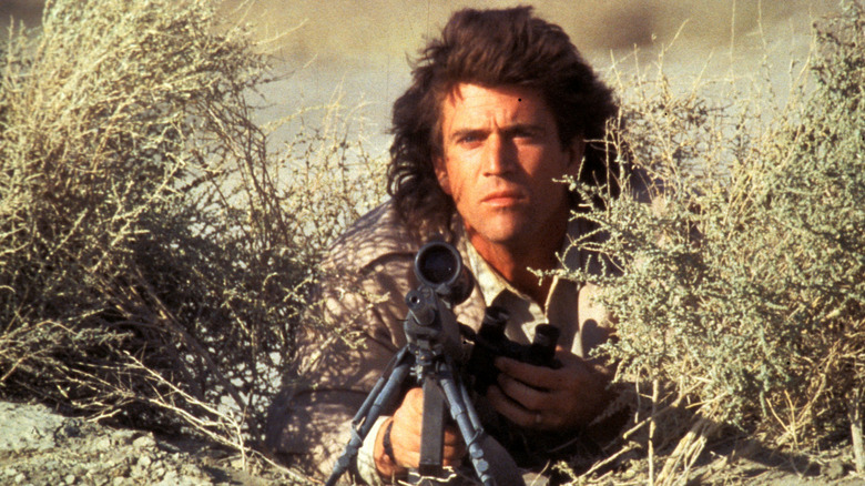 Riggs with rifle