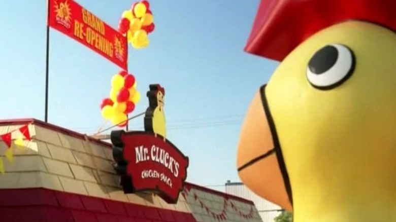 Mr. Cluck mascot stands ominously