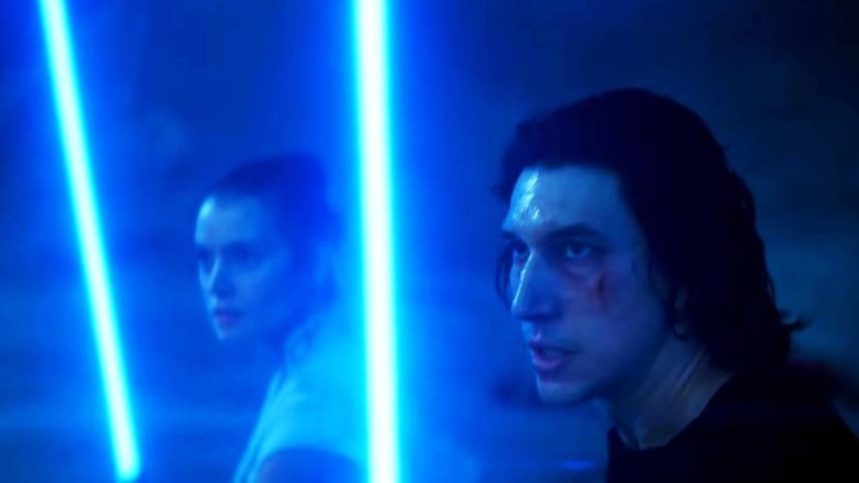 Rey and Kylo with lightsabers