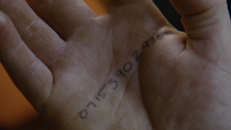 Hand with numbers written on it