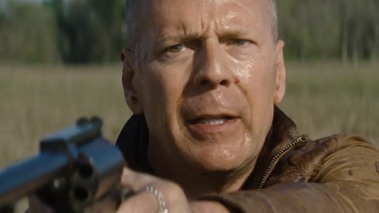 Bruce Willis holds gun