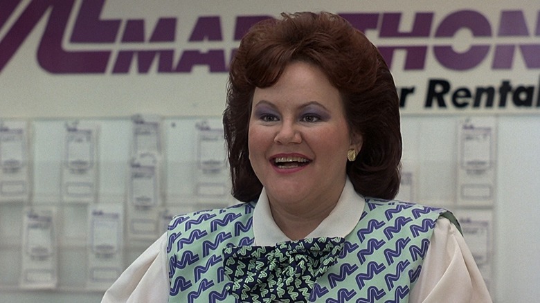 Edie McClurg at car rental counter