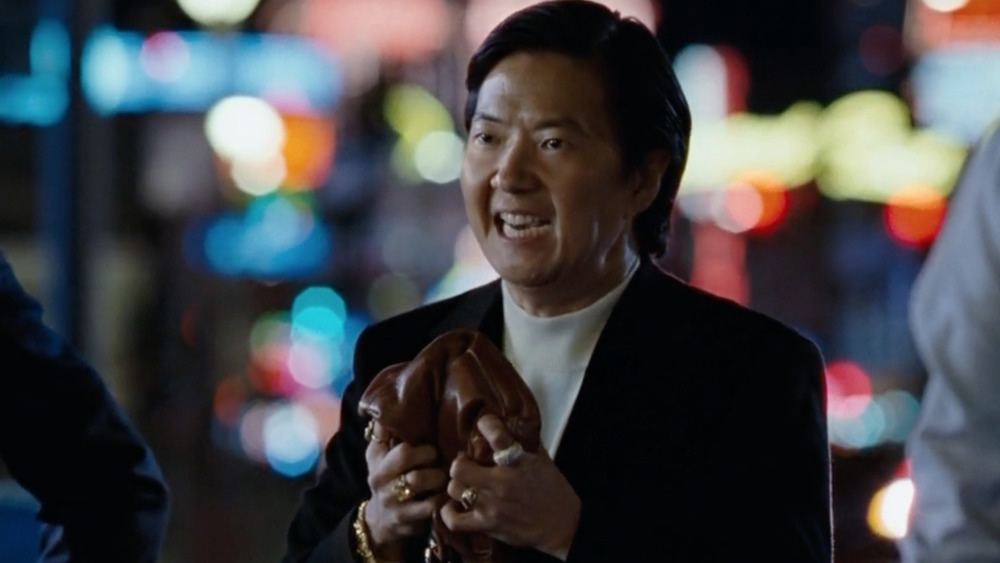 Leslie Chow holding purse