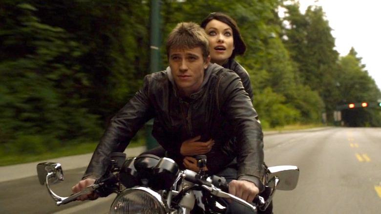 Sam and Quorra riding a motorbike in the real world