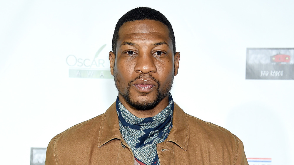 Jonathan Majors posing on red carpet