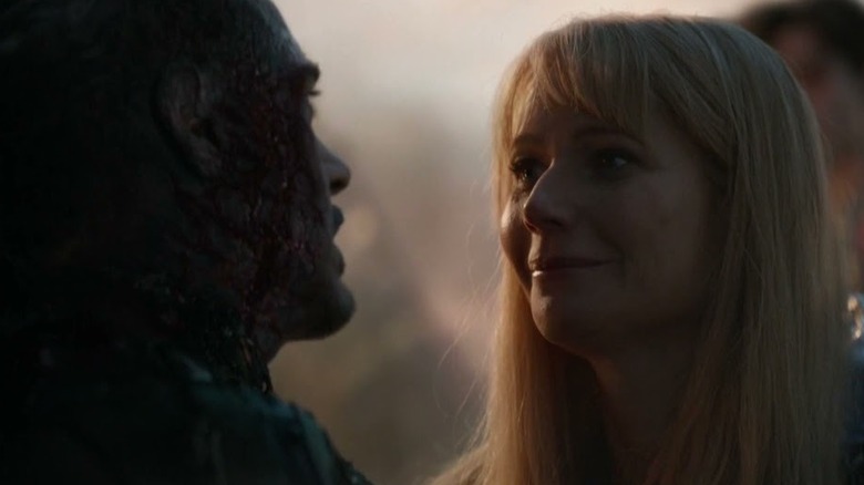 Pepper Potts cries next to Tony Stark