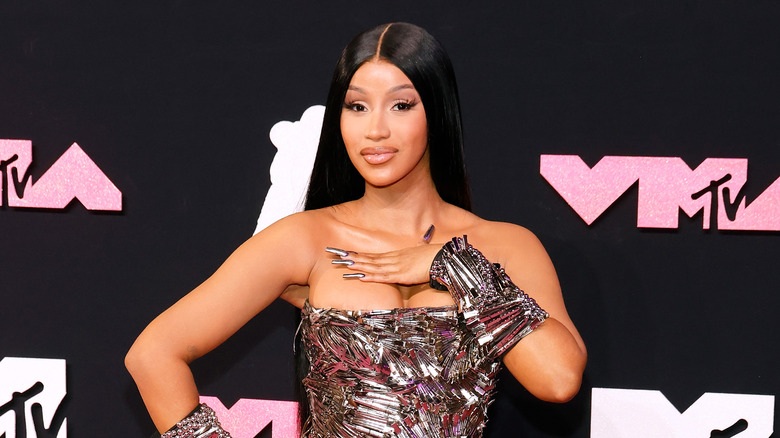 Cardi B looking forward silver dress