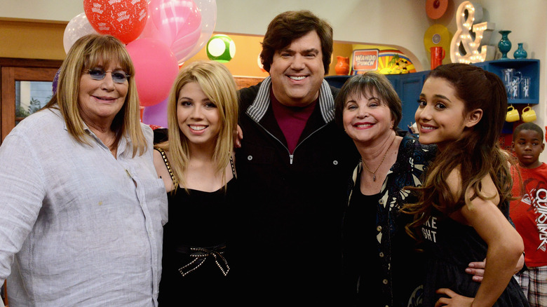 Dan Schneider posing with cast