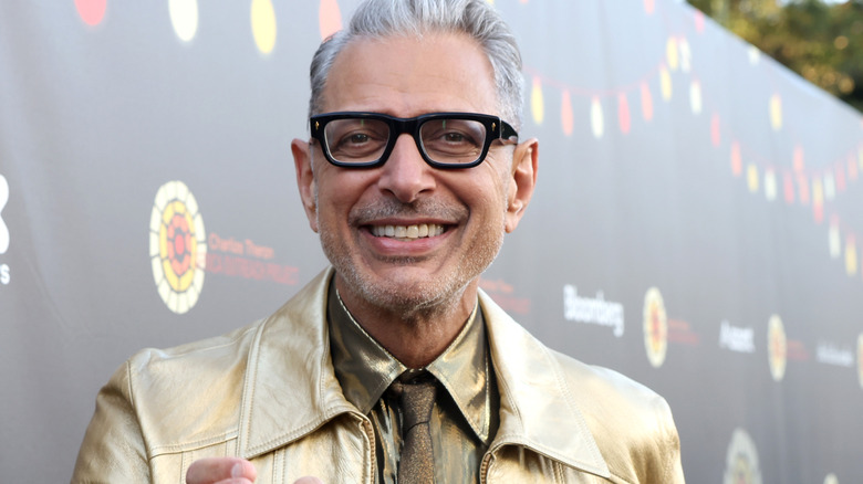 Jeff Goldblum smiling for photographers 