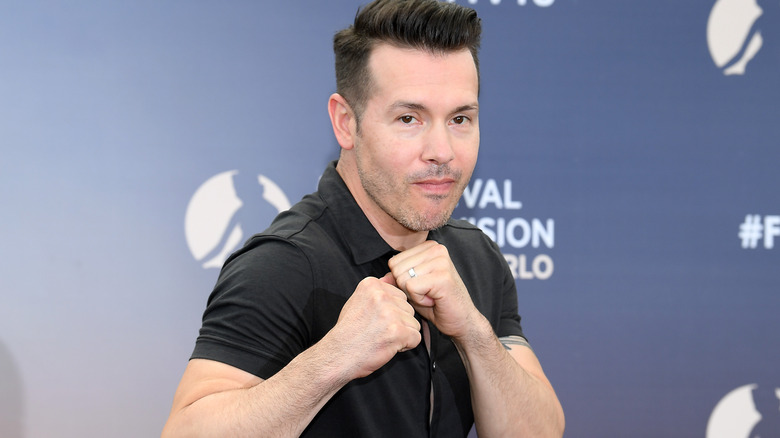 Jon Seda with fists raised