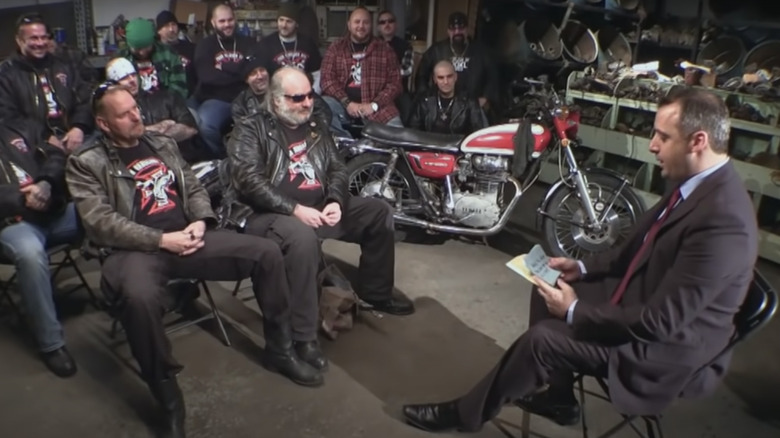 Joe Gatto talking with motorcycle gang