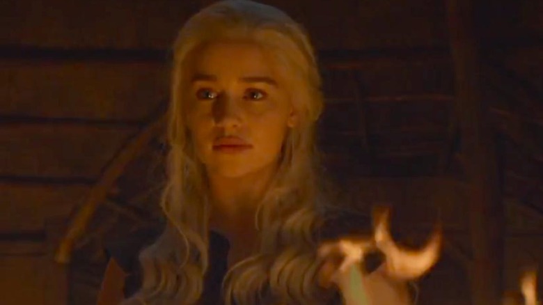 Daenerys stands by fire.