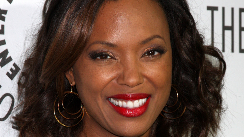 Aisha Tyler smiling at event