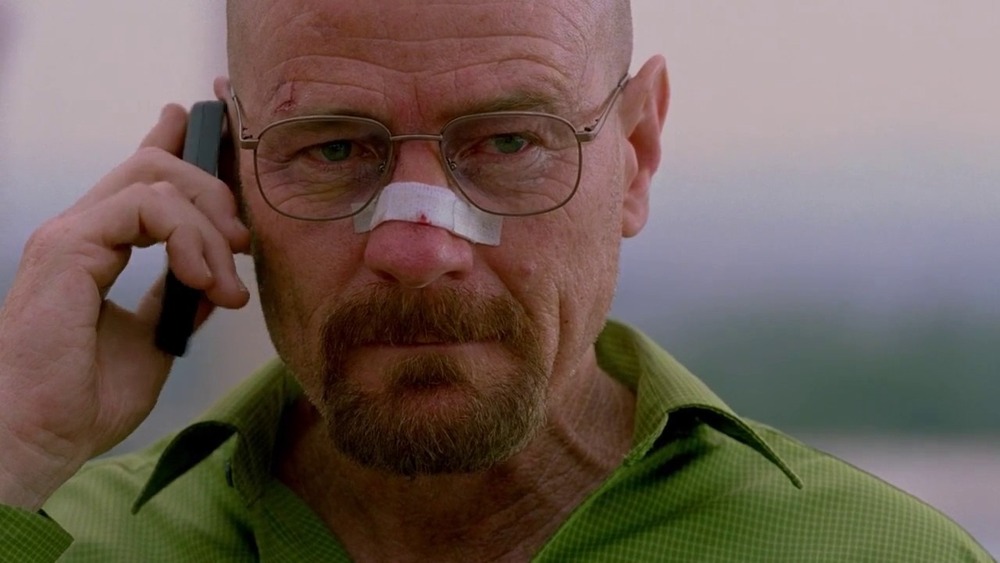 Walter White with nose bandaged on the phone